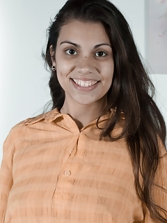 Camille S Stands In Her Orange Top And Denim Skirts