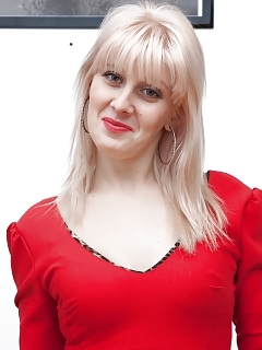 Sandrina Is A Exciting Blonde Who's Loving Her Red Dress And Black Nylons