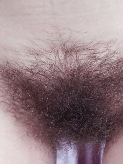 Promesita Sits With Her Leather Jacket And Black Nylons On