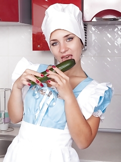 Tanita Is Dressing Her Blue Dress And White Pinafore In Her Kitchen