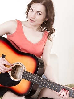 Whitney Enjoys The Guitar So Good And Does It On Her Bed While In A Denim Skirt