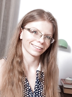 Ekaterina Ananasova Sits At Her Table Reading And Exhibiting Off Her Panties Up Her Skirt