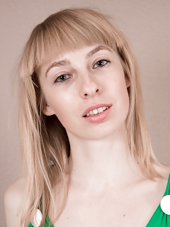 In A New Green Dress, Natinella Is Finishing Ironing Her Underwears